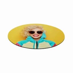 A round mouse pad featuring a smiling woman with curly blonde hair, wearing sunglasses and a colourful hoodie against a yellow background.