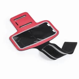 A red and black armband with a clear plastic compartment for holding a phone or card, featuring adjustable Velcro straps.