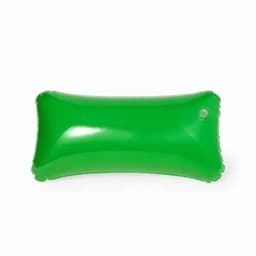 An inflatable pillow in bright green, featuring a rounded rectangular shape and a small air valve.
