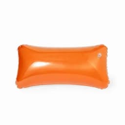 An inflatable orange pillow with a smooth surface and a small valve. It features rounded edges.