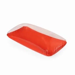 A red inflatable pillow with a transparent top, featuring a smooth, glossy surface and a simple rectangular shape.