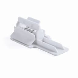 A white plastic product holder with a spring mechanism and a flat base. It features a simple, functional design.