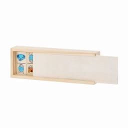 A wooden box containing colourful animal game pieces, featuring blue, orange, and pink designs. The box has a sliding lid.