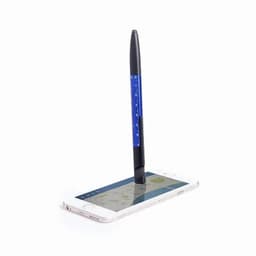 A black pen balanced on a smartphone displaying a map, with a white background. The pen has a blue barrel.