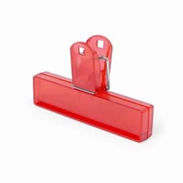 A red clipboard with a metal clip on top for holding papers securely.