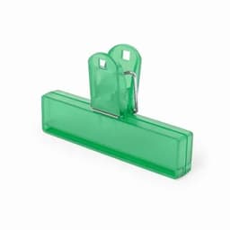 A green paper clip with a flat base and two rounded handles for easy gripping. It features a simple design and style.