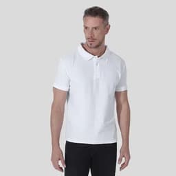 A polo shirt in white, featuring a classic collar and short sleeves, worn by a model.