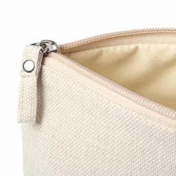 A cream zippered pouch featuring a textured fabric and a metal zipper pull.