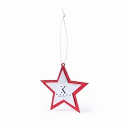 A red star-shaped ornament with a silver interior and a hanging string, featuring a brand logo.