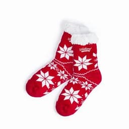 A pair of red socks with white snowflake patterns and a fluffy white cuff, featuring a logo.