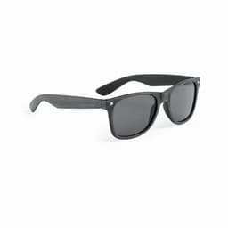 A pair of dark grey sunglasses with a classic frame design and dark lenses. Features a logo on the side.