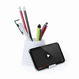 A white desk organiser holding pens and pencils, with a smartphone on a stand in front, displaying a black screen.