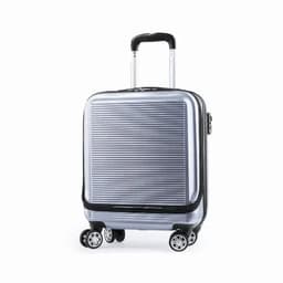A silver hard-shell suitcase with a ribbed design, featuring four wheels and a retractable handle.
