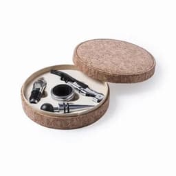 A gift set in a round cork container, featuring a corkscrew, pourer, stopper, and other wine accessories.