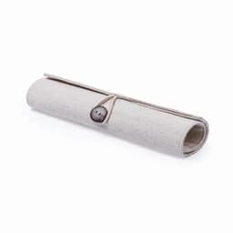 A rolled-up fabric organiser in a light beige colour, secured with a button closure.