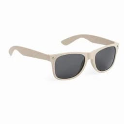 A pair of beige sunglasses with dark lenses and a minimalistic design, featuring a logo on the frame.