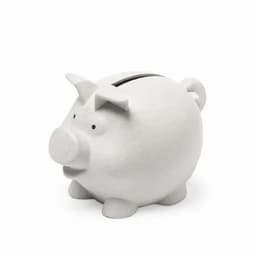 A white piggy bank with a slot for coins and small eyes, featuring a rounded shape and a snout.