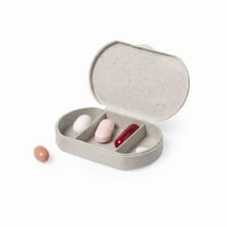 A pill organiser with a grey container, featuring compartments for three capsules and two whole pills.