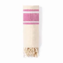 A woven towel featuring a cream base with pink stripes and tassels at one end.