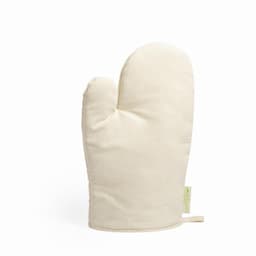 A cream-coloured oven mitt with a textured surface and a loop for hanging. It features a small logo.