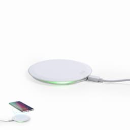 A wireless phone charger in white with a light indicator. It has a sleek, round design and a connected cable.