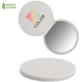 A round compact mirror made from wheat straw, featuring a textured white exterior and a reflective surface.