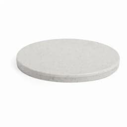A circular marble serving board in a light grey colour with a smooth surface and a thick edge.
