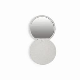 A compact mirror with a round design in a speckled light grey finish, featuring a reflective surface.