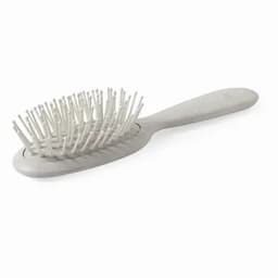 A hairbrush with a grey handle and bristles, featuring a simple design. It has a logo on the handle.