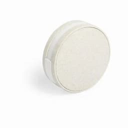 A round, off-white eco-friendly container with a smooth surface and a sliding lid.