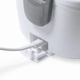 A drink bottle in white with a grey accent, featuring a power connection at the base.