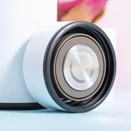 A drink bottle with a silver cap and a white body, featuring a black rubber ring around the base.