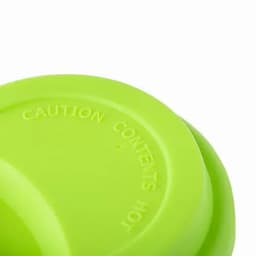 A drink bottle with a bright green body and a textured surface, featuring an embossed warning on the rim.