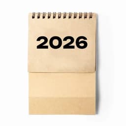 A spiral-bound calendar featuring a large, bold '2026' on the top page. The colour is a natural brown or kraft.