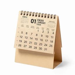 A desk calendar displayed with a spiral binding, featuring a minimalist design in beige, showing January 2026.