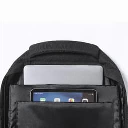 A black backpack with a laptop and tablet stored in separate compartments. The interior is sleek and minimally designed.