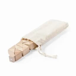 A set of wooden blocks with a natural finish, presented in a cream-coloured fabric pouch.