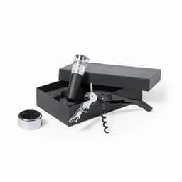 A wine accessory set featuring a corkscrew, pourer, and foil cutter in a black gift box with foam padding.