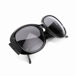 A pair of oversized black sunglasses with dark lenses, angled slightly to display their shape and design.