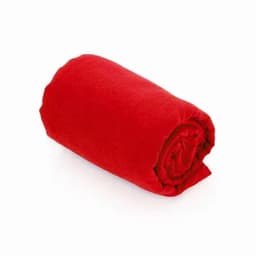 A rolled-up red blanket made of soft material, featuring a smooth texture.