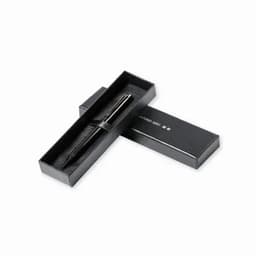 A black pen displayed in an elegant black box with a simple design and an interior lining.