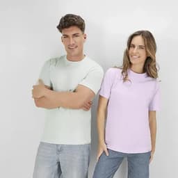A mint green and a lilac T-shirt worn by a man and a woman, both smiling. Each shirt has a logo.