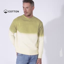 A sweater with a gradient design, featuring light yellow and green hues, worn by a man. The fabric is cotton.
