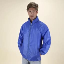 A man wearing a bright blue, lightweight jacket with a zip and high collar, set against a plain background.