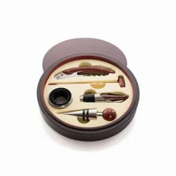 A gift set featuring a corkscrew, wine stopper, pourer, pen, and hammer in a round wooden box with cream padding.