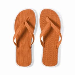 A pair of orange flip-flops with a textured sole and white detailing. The straps are made of fabric.