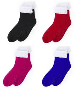 A collection of four pairs of fuzzy socks in black, red, pink, and blue with white fur cuffs and non-slip soles.