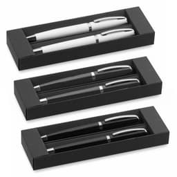 A set of pens in black and white, displayed in three black gift boxes. Each set contains two pens with silver accents.