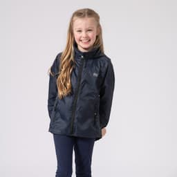 A navy packable jacket with a hood, featuring side pockets and a logo, worn by a smiling child.