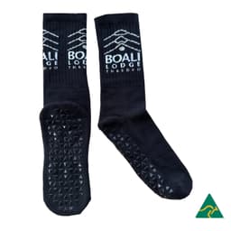 Crew Grip socks in black with textured soles and a logo on the upper side.